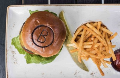 B-Lux Grill & Bar Burger and Fries. We invite you to explore our menu.